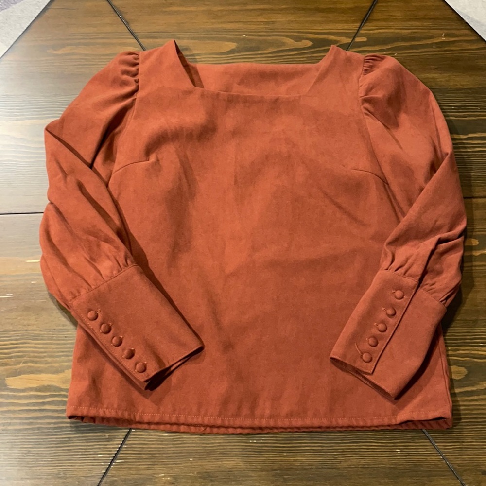 Orange long sleeve top with square cut neckline
